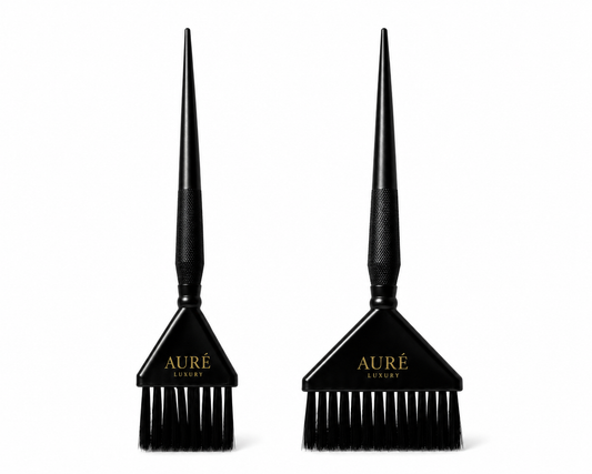 Two black hair dye brushes with 'Aure' branding on a white background