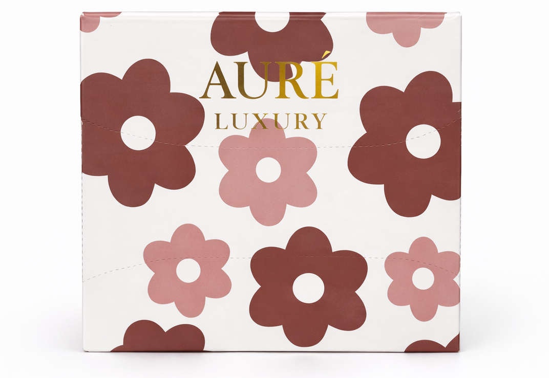 Aure luxury product packaging with floral design on a white background